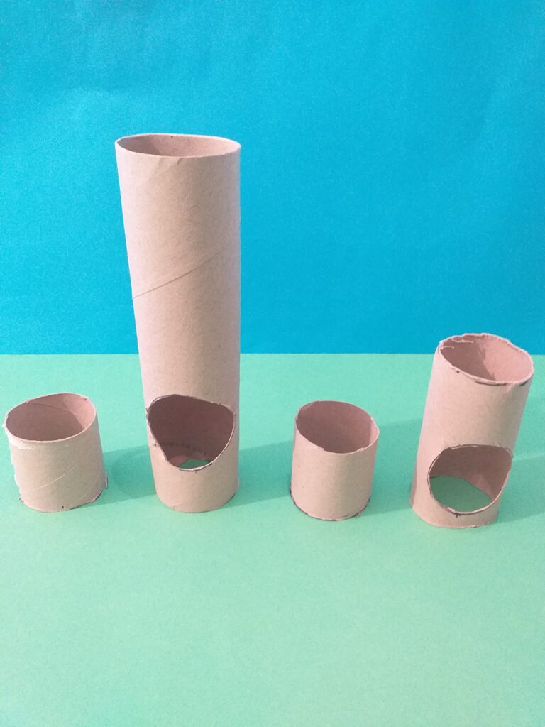 Cut tubes add holes to make a giraffes.