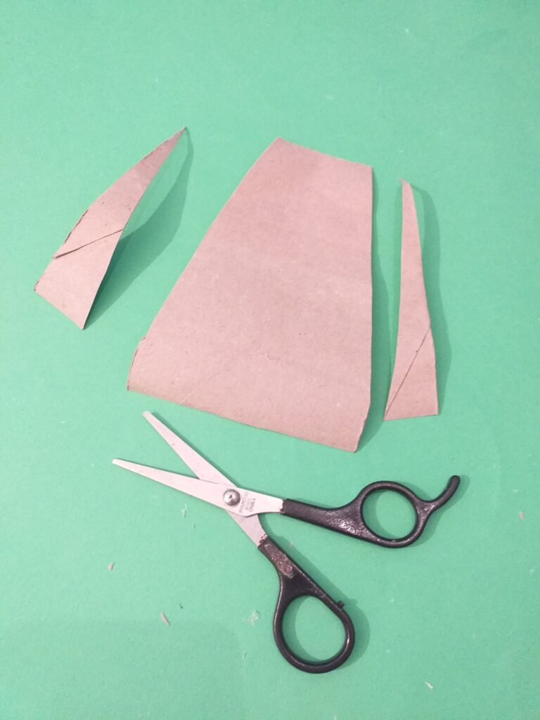Open smaller tube and cut out shape to make bottom part.