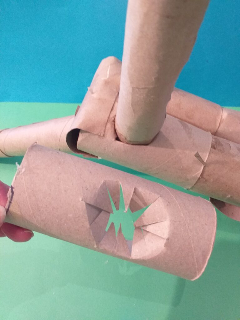 Fan 4 holes underside to insert legs and push in. (shown below, in example)