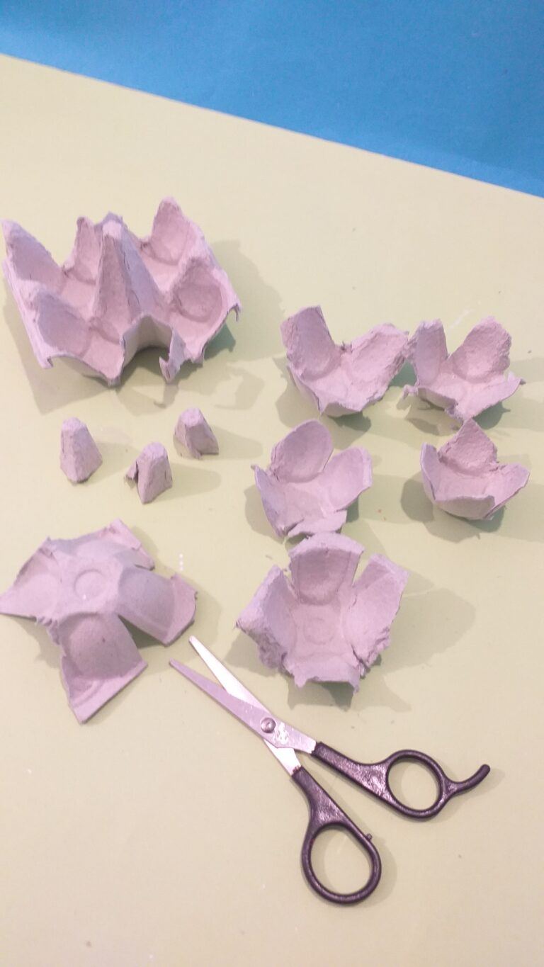 10) Trim off rough edges and cut 4 petal shapes on each egg cup.