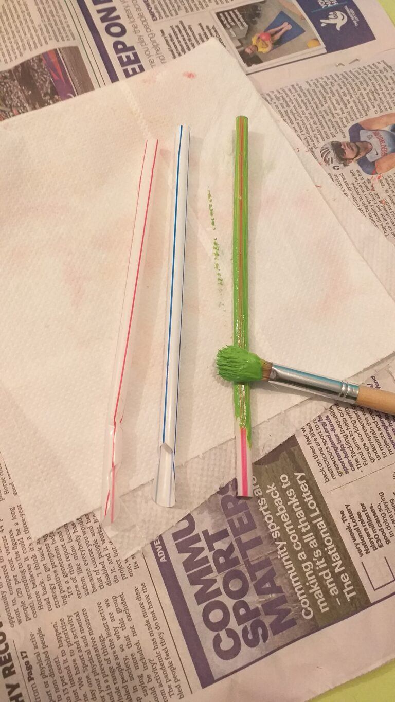 17) Paint the straws with green paint.