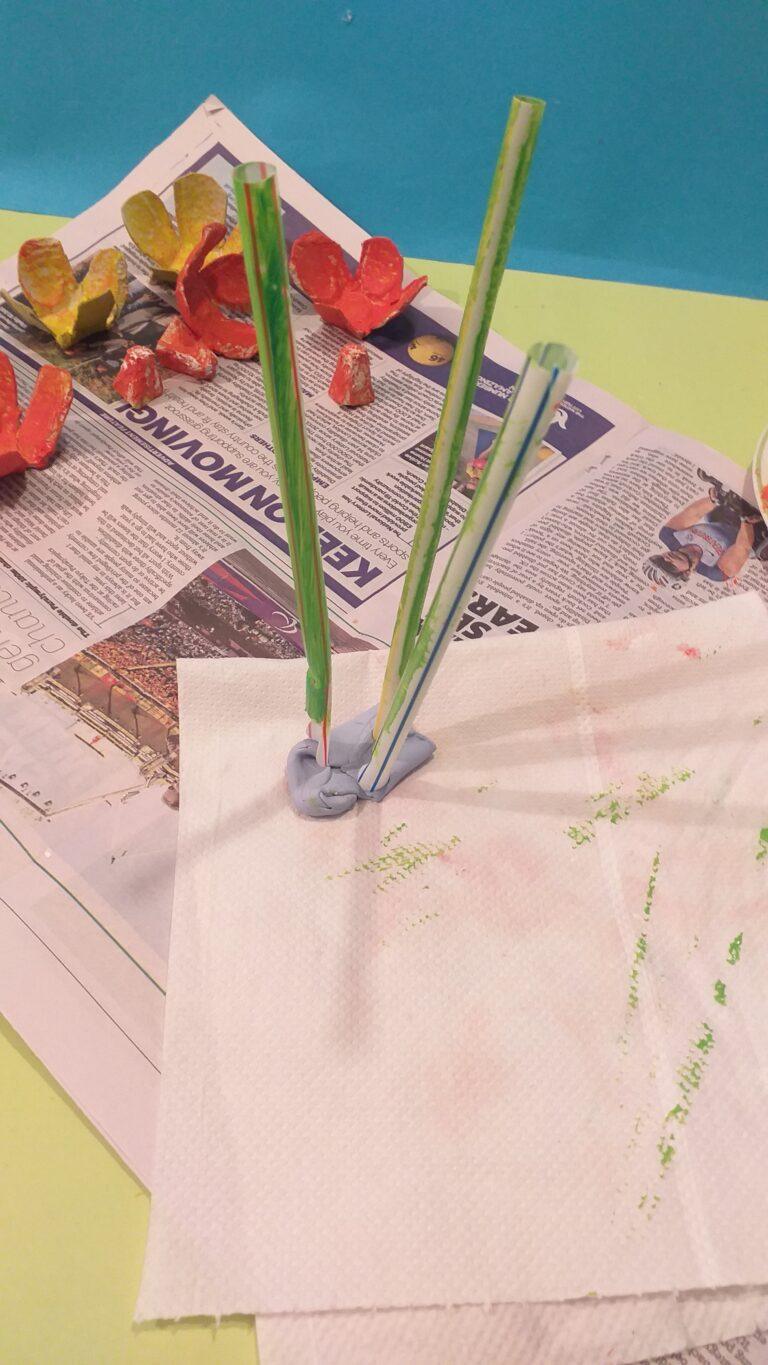 18) To help use blu tack to hold straws whilst you paint them.