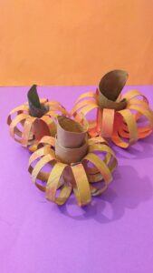 large pumpkins crafted from cardbord tubes.
