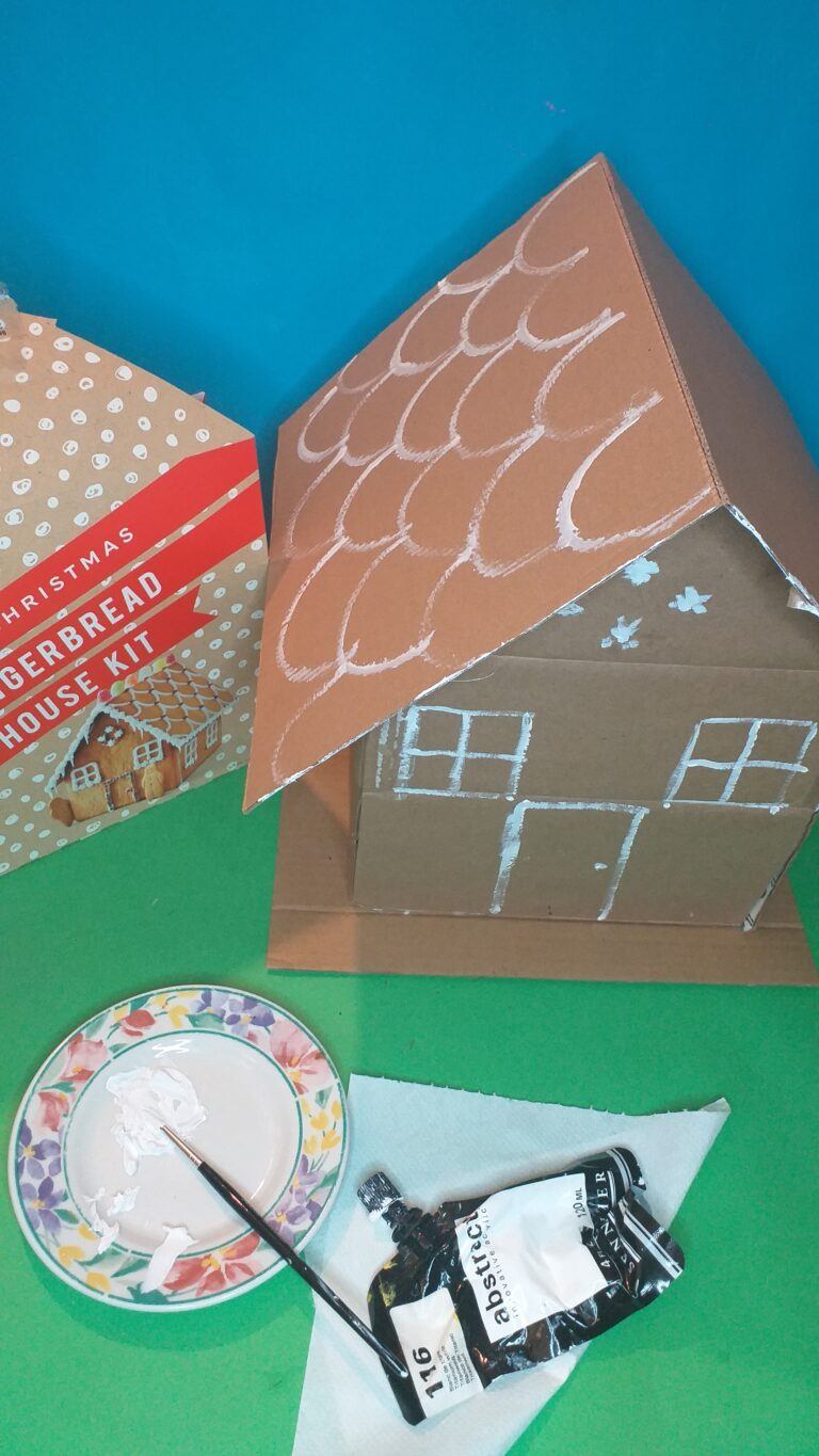 13) Checking the style of the Gingerbread house paint on with white paint roof, windows and door.