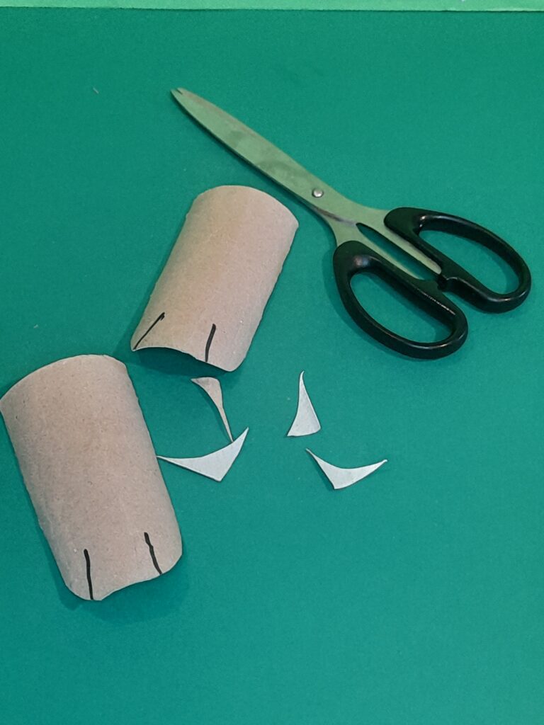 6) Now cut out 2 bunny feet, cut corners and draw in a couple of lines for toes.