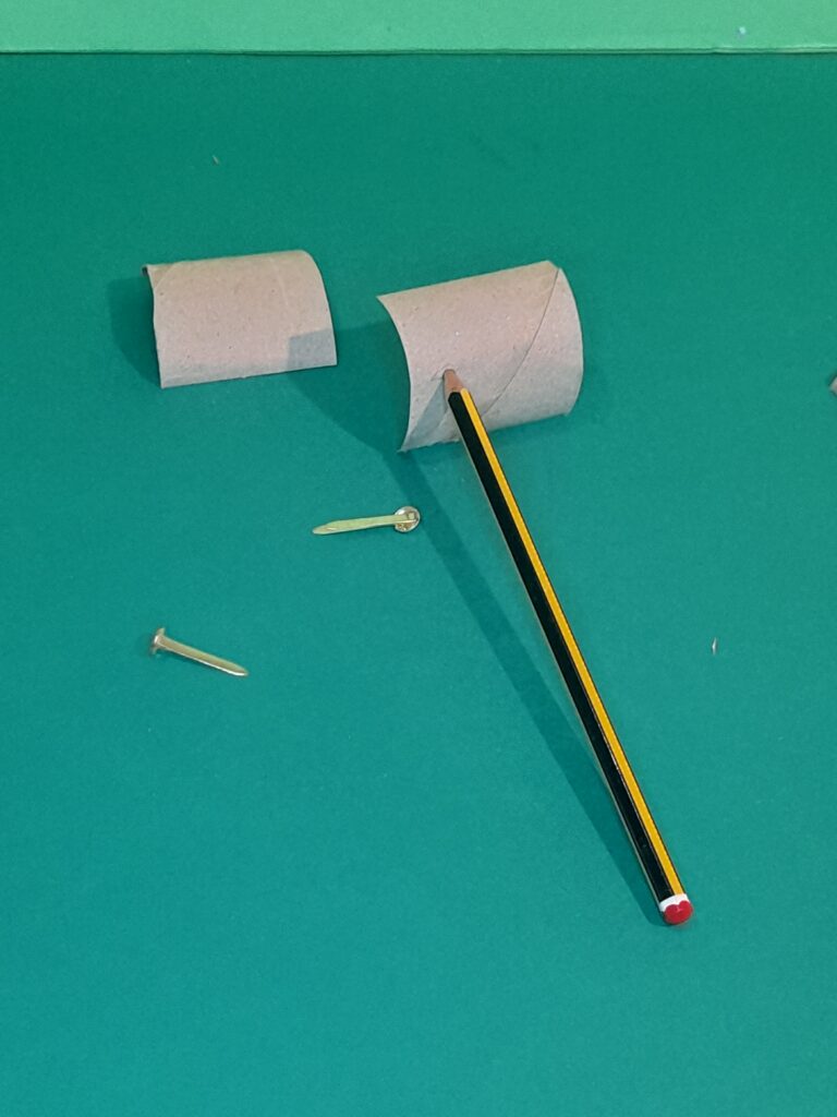 8) With half of a tube cut that in half again, make a hole with pencil to push split pin in, attach to the other half these will make one arm.