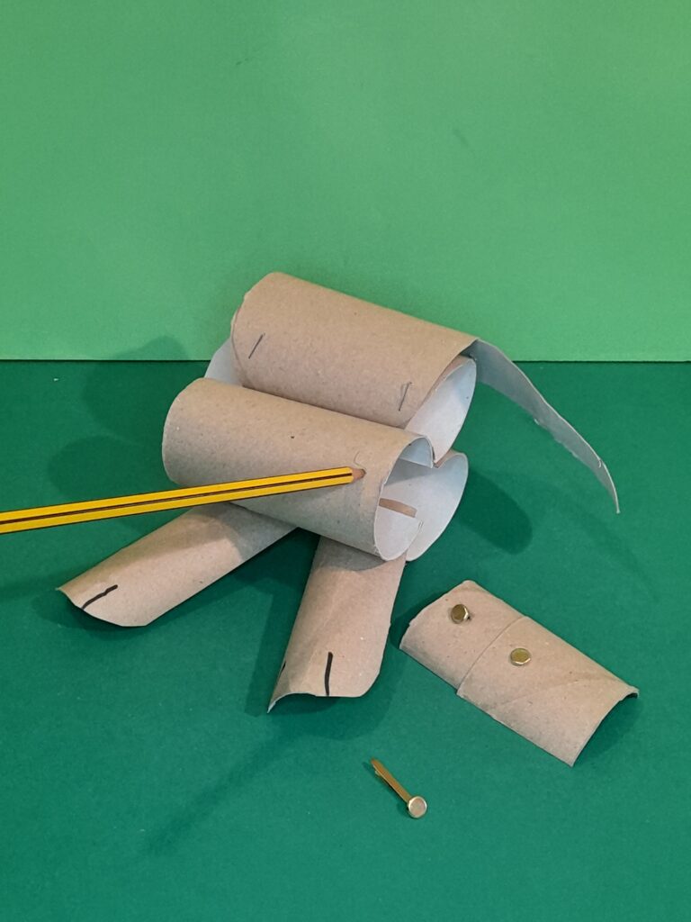 9) Pierce a hole with the pencil, then push split pin into this and fix on the underside.