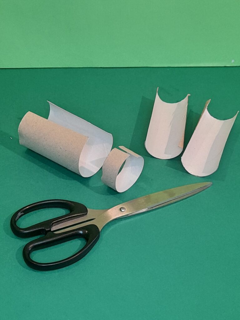 12) To make the hammer cut one tube in half long ways and cut off end bit, then to make handle curl half a tube into a cylinder., so it's narrower.
