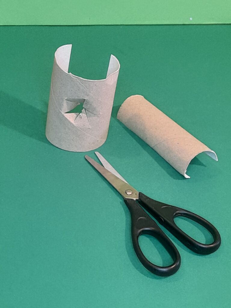 13) With the bigger tube pierce hole and fan all the way round and push through the narrower tube as the handle.