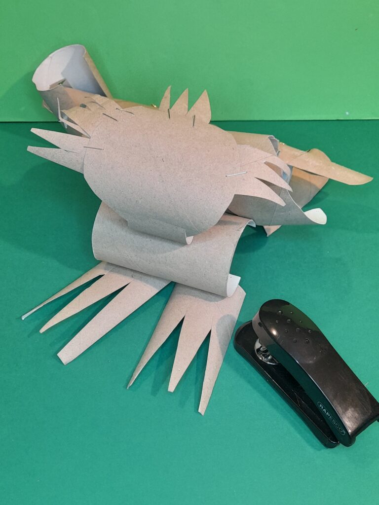 18) Staple feet onto the bottom tube.