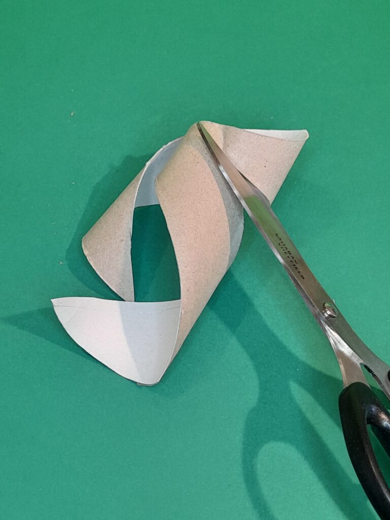 19) Follow the curl of the tube cutting it out.