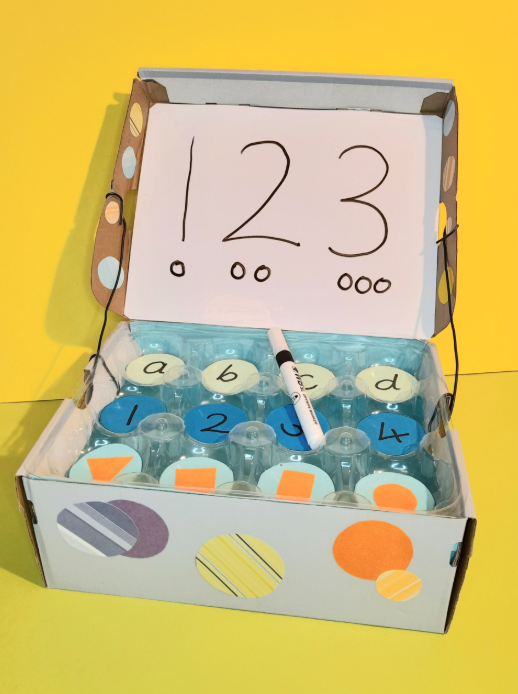 Shoebox crafts numbers and dots.