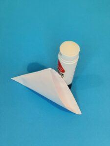 10) Fold over and glue together, there should be an opening at the bottom, pull open to form a bigger sail.