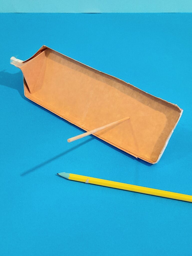 3) Pierce a hole off centre and run a straw through hole. You can pierce 2 hole depending where to position sails.