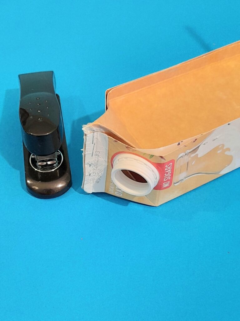 6) Two parts will fit together hold fimly and staple. Now you can make 2 types of sails. Next is a square sail.