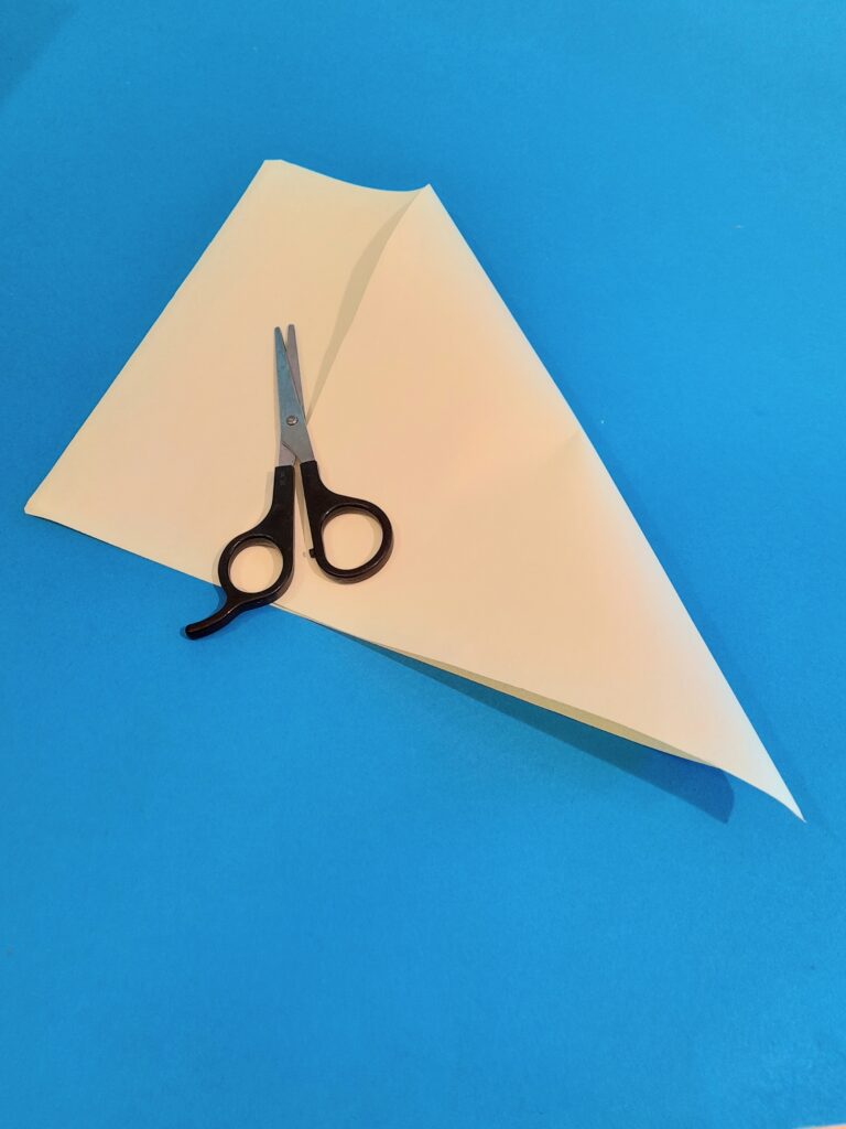 9) Take A4 sheet, fold right corner down to meet the bottom.