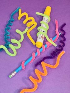 9) Curl around pencil and broad marker all the pipe cleaners as shown.
