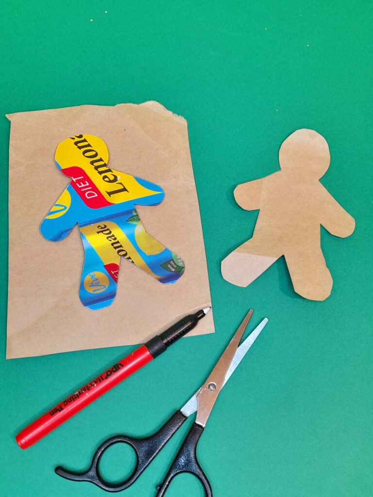 10) Grab your wrapping up paper and draw the gingerbread man cut out, using a template of a gingerbread man.