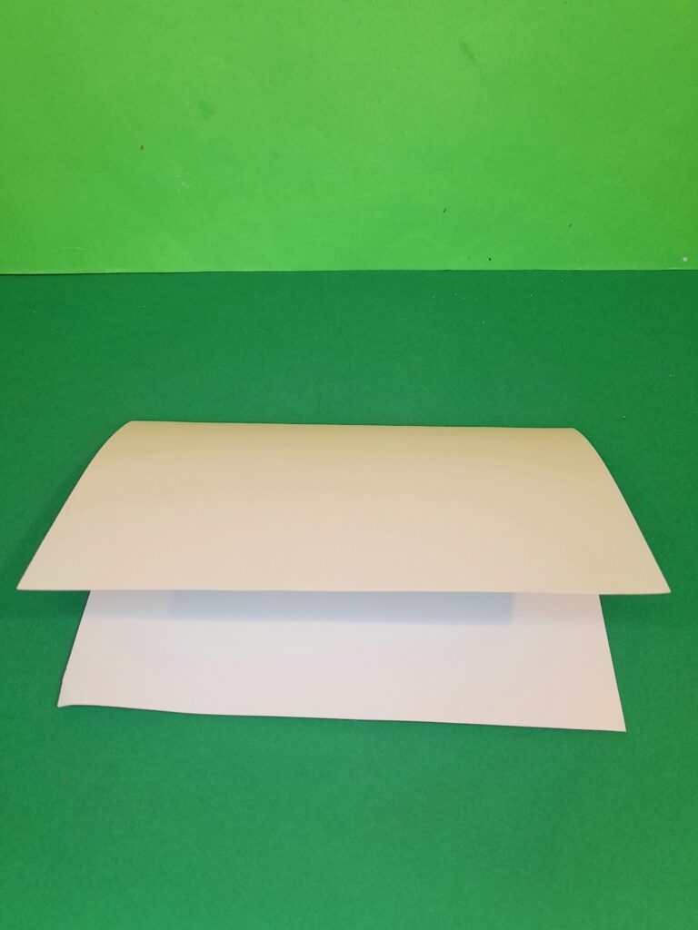2) Fold in A4 card in half.