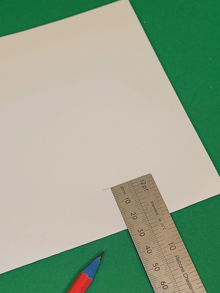 3) Measure 25mm in on the shorten side and 50mm on either side in.