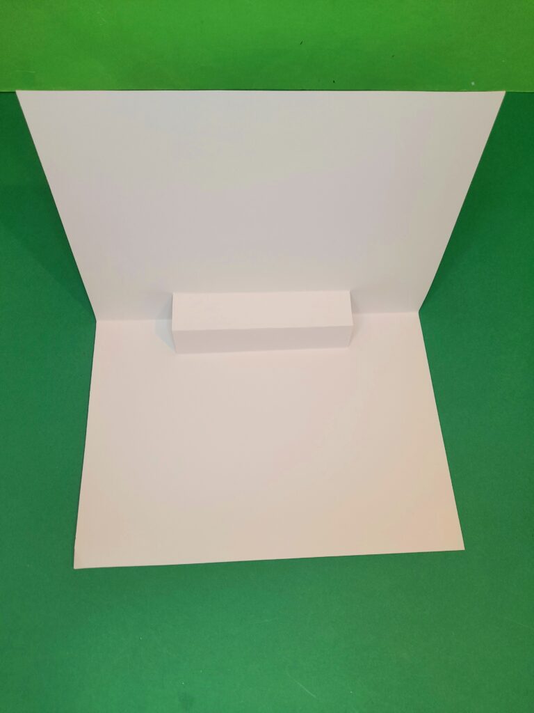 7) Turn the card around and there will be a box like shape in the center of the fold..