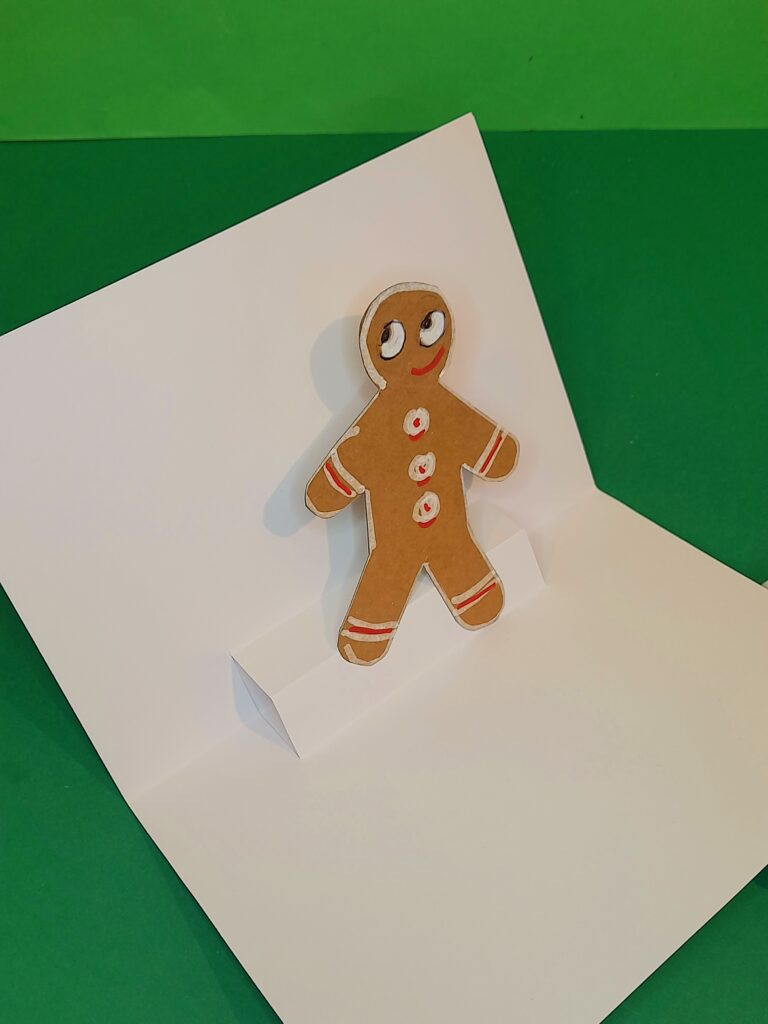 15) Use glue stick and secure him with both feet on block. Close card to check all's good.