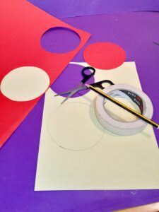 17) Now use masking tape to draw around and make big circles, cut out in 2 colours.