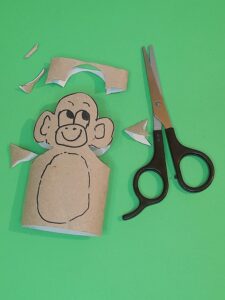 6) Carefully cut around the monkeys head, ears and a triangle piece on each side for shoulders.