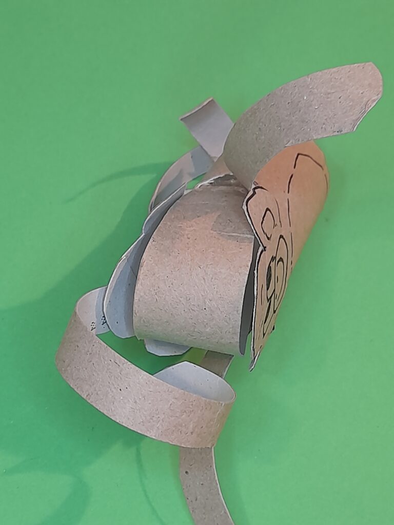 15) Once its pushed to the top secure all tapes inside the sides of the monkey.