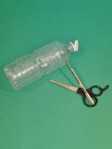 1) Using a scalpel carefully cut top part of bottle.