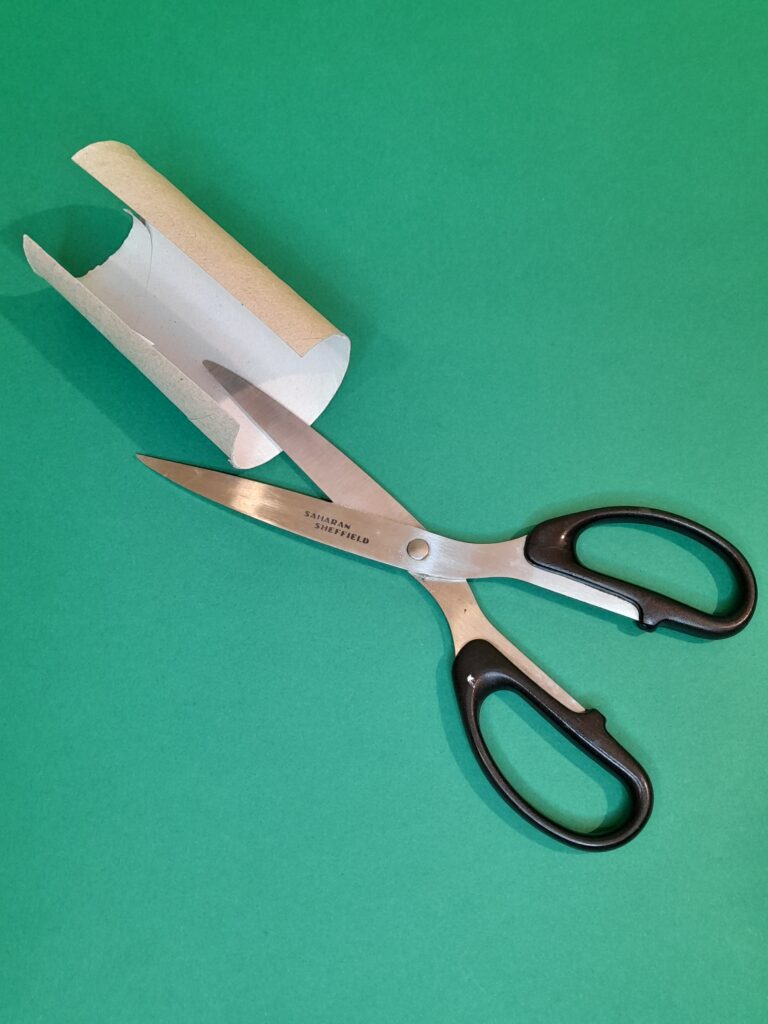 1) Take one tube and cut vertically and prize open.