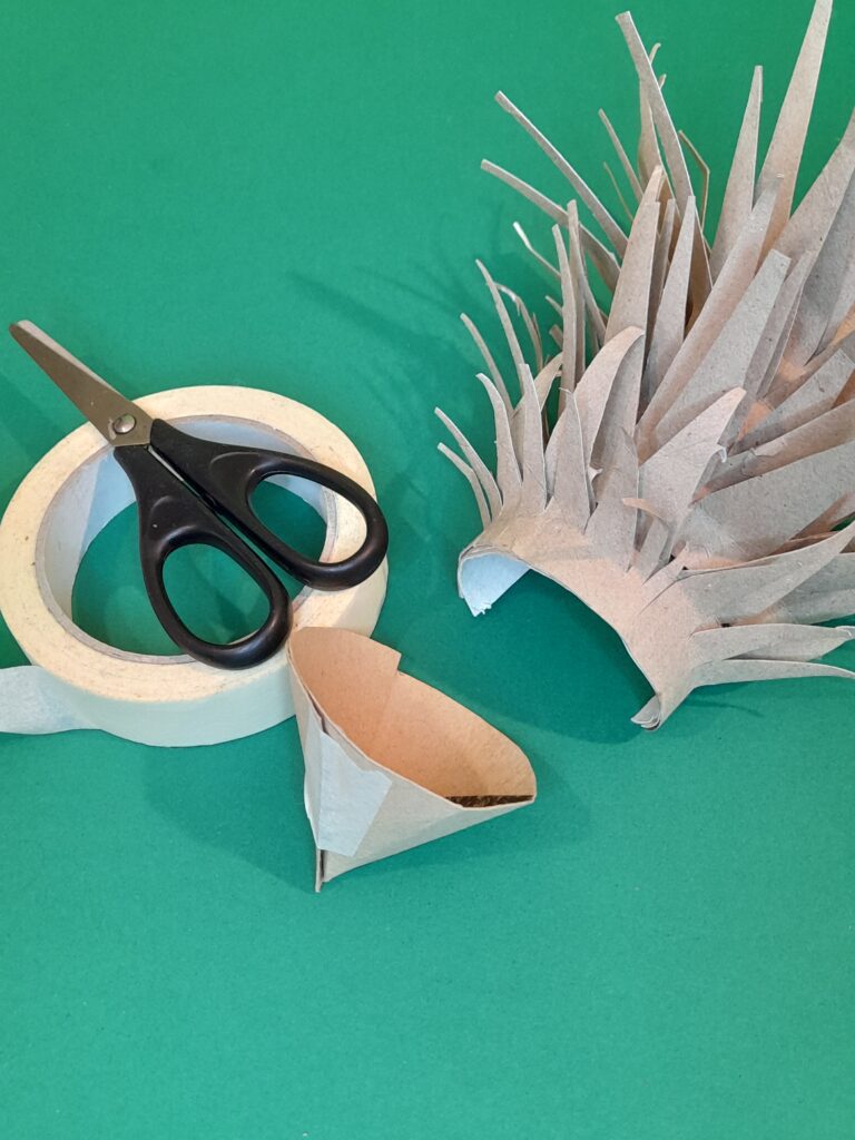 18) Before you tape cone keep applying to the body of the hedgehog so it fits snuggly, when you happy hold in place with tape.