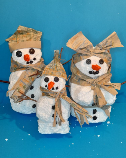 Snowman family made from Styrofoam.