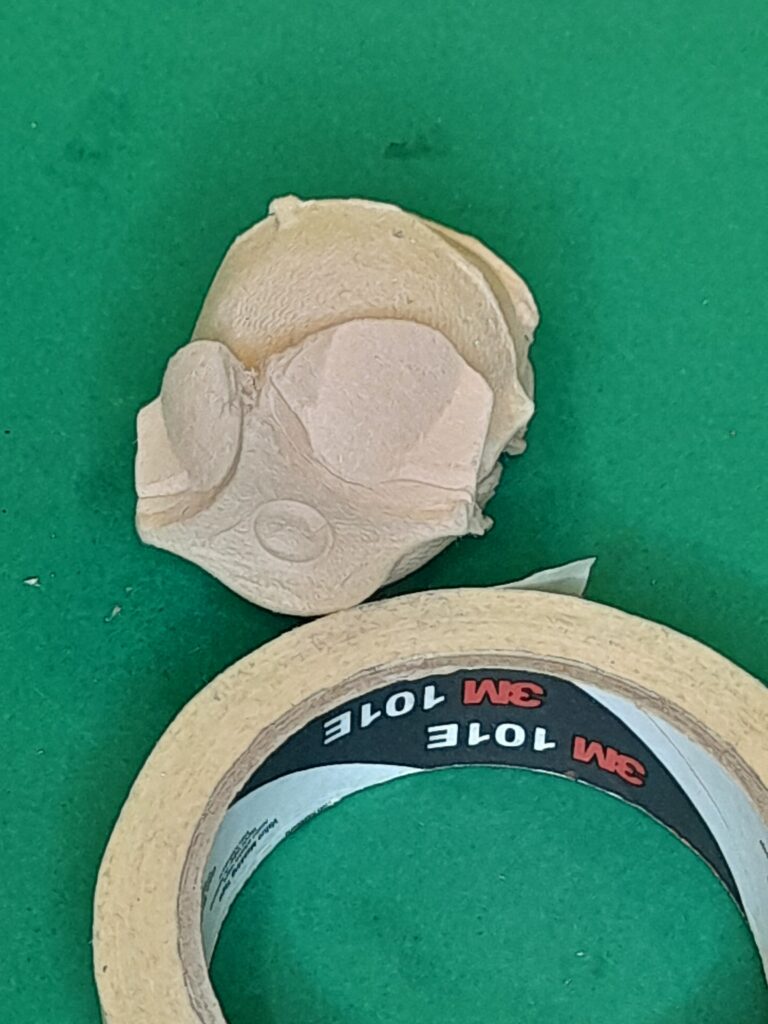 2) The face should be the part of the egg-cup that can be shaped like goggles.