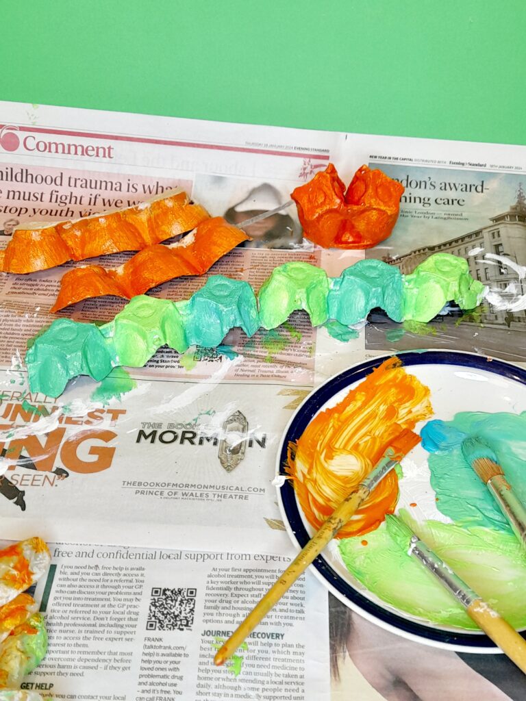 11) The half egg cartons that slide underneath, paint in a bright orange.