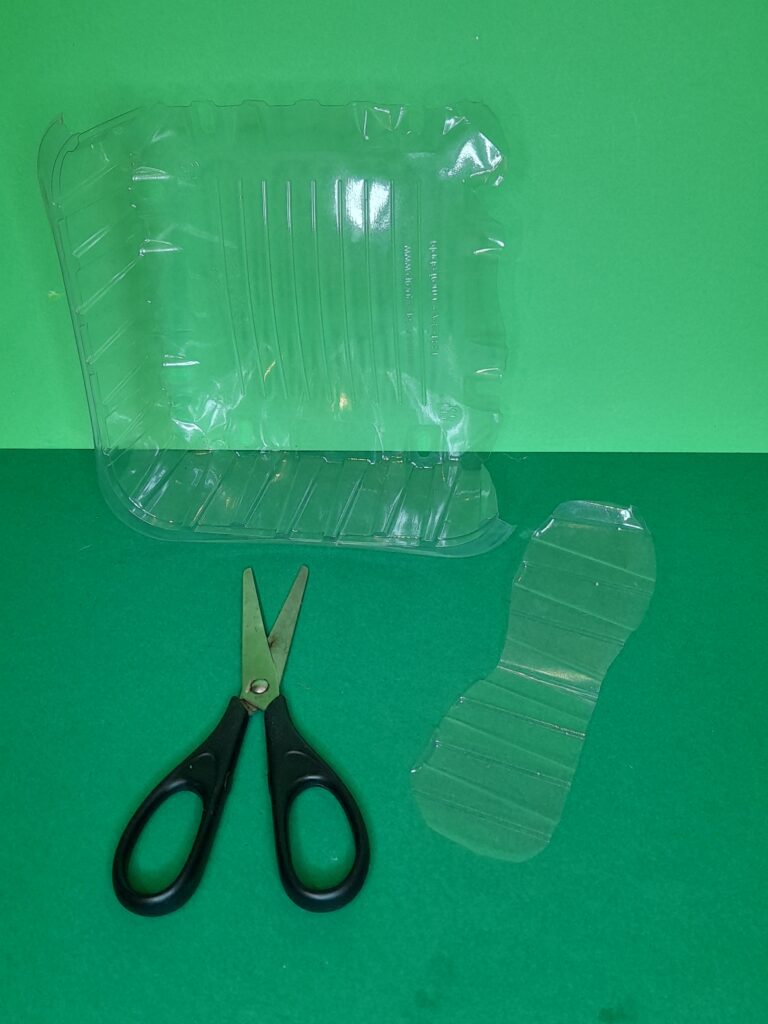 8) Cut out from plastic casing a pair of wings.