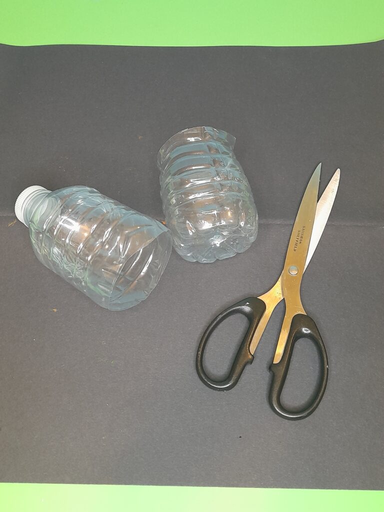 1) Cut in half a small plastic bottle.