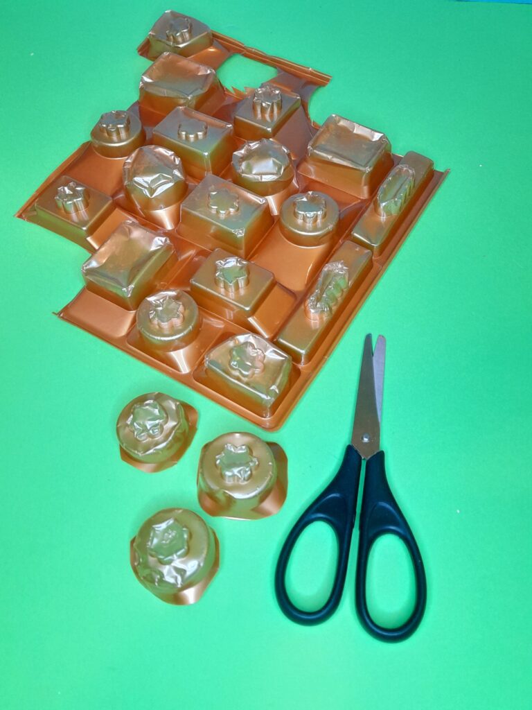 14) Take the chocolate holder and cut out the circular cups.