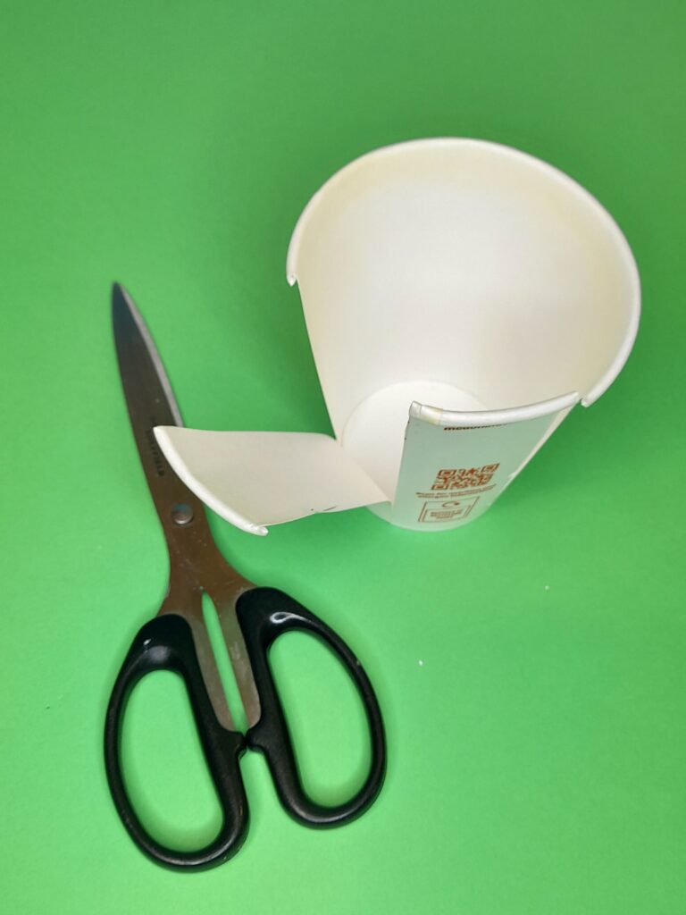 16) Take a paper cup and cut as many leaves all the way around.