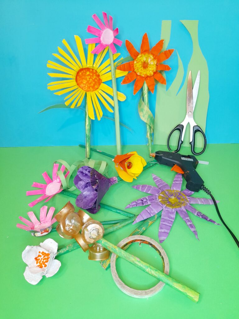 28) Cut out green leaves from green card and long sections to curl and use for decoration. Use double-sided tape where required.