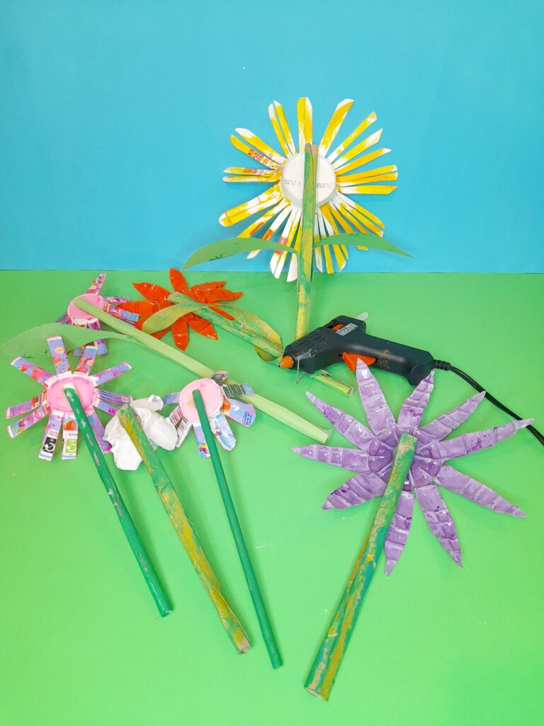 27) Turn flower head over and use hot glue to stick onto green stems.