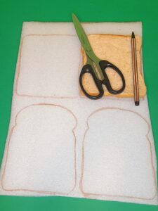 1) Grab white sponge material and draw around chosen bread.