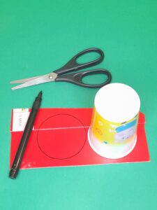 6) Take red card and use pot or cup to draw around for tomatoes.