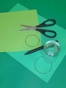 7) Take a smaller glass to draw around for cucumber. Use 2 shades of green card. Darker one for the rim, the lighter shade for the inside of the cucumber, then glue the smaller one in the middle of the bigger one wth glue stick.