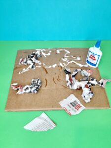 Continue to glue on to the tree outline with PVA glue.
