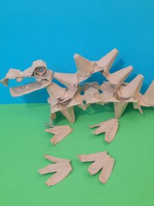 Glue on four feet with hot wax on to each egg box leg.