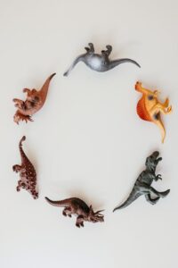 Playing with dinosaurs.