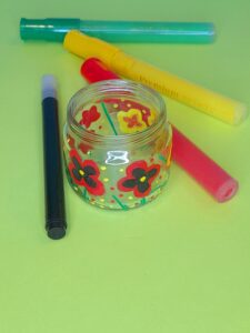 Paint black leaves inside the red flower.