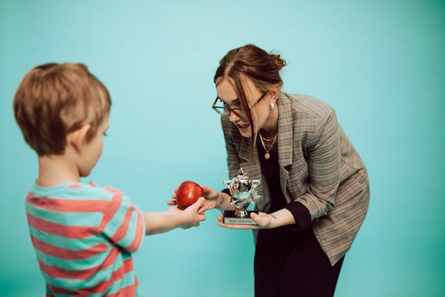 A boy thanking his teach. Picture from Pexels.com By RDNE stock project.