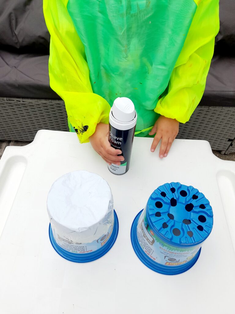 Shaving foam and 2 flower pots.